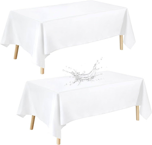 white covered square tables